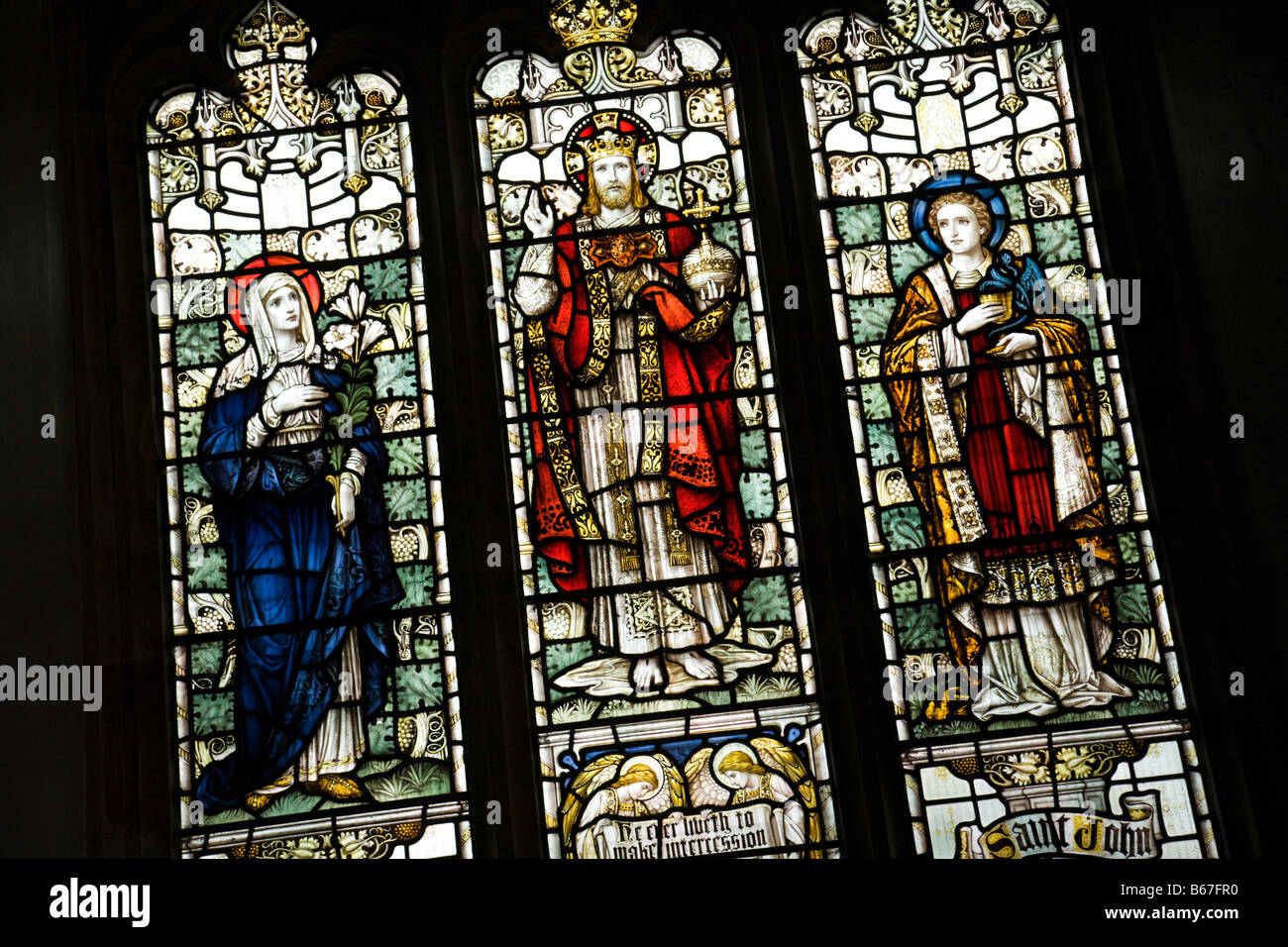 Stained glass window with Jesus, Mary and John; Friston Church, Suffolk