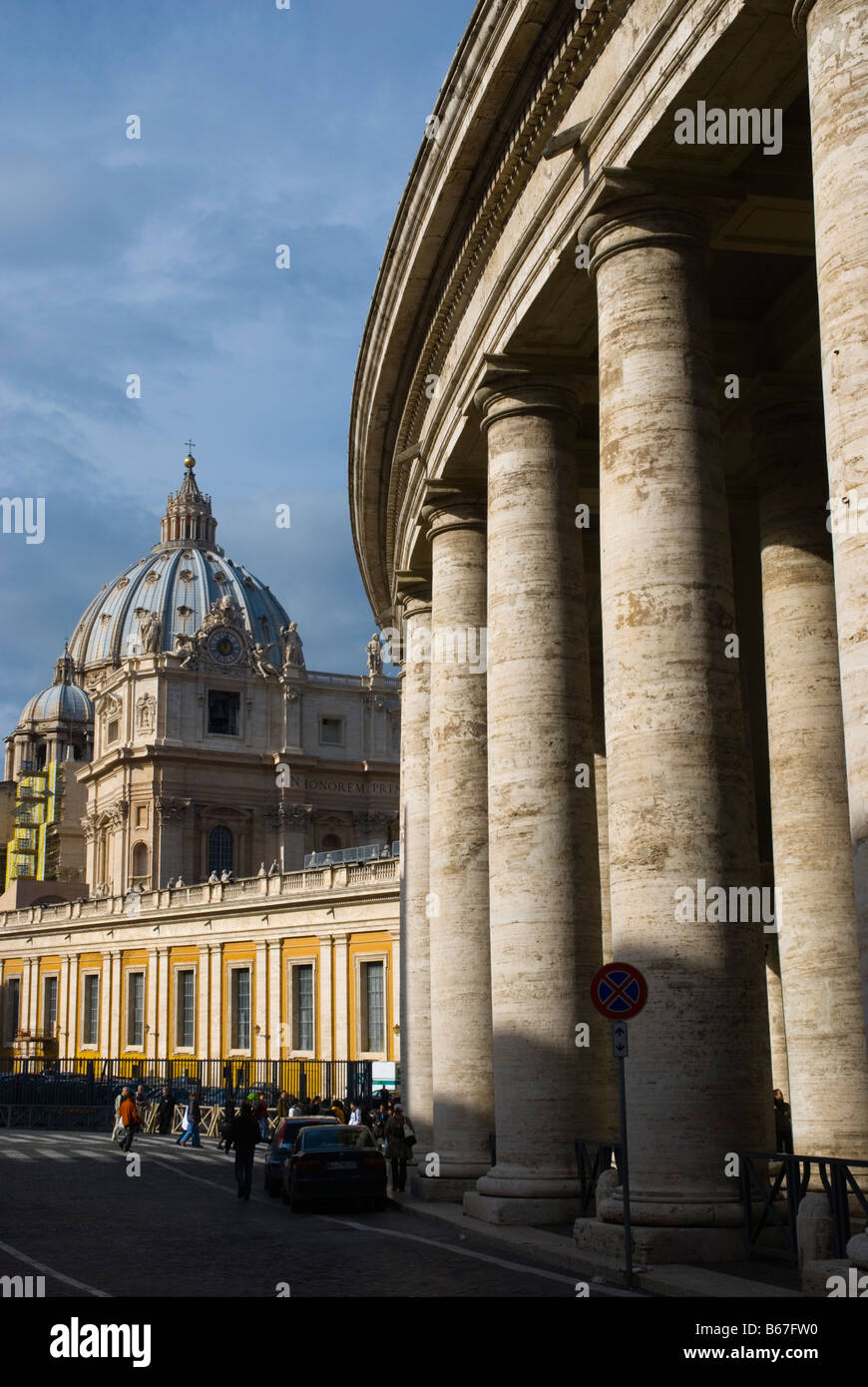 Bernarnini s columns and the dome of Saint Peters church in Vatican City in Rome Italy Europe Stock Photo