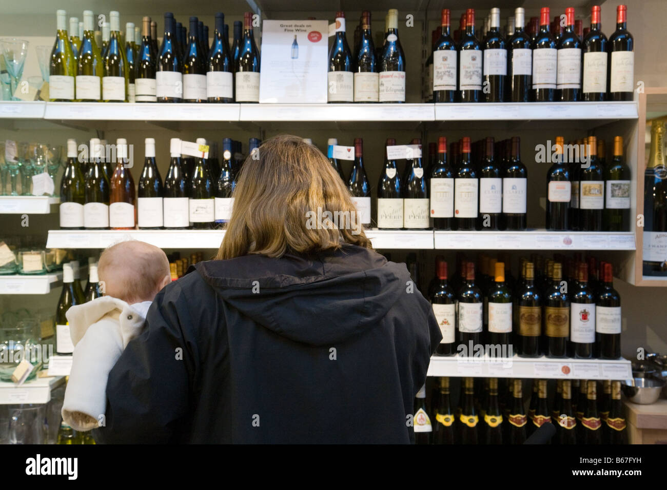 Mother and baby buying wine Stock Photo Alamy