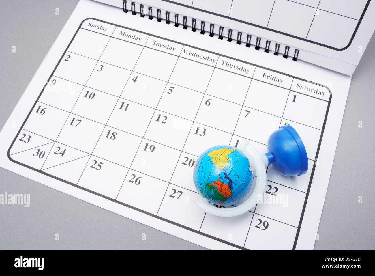Desk Globe on Calendar Stock Photo Alamy