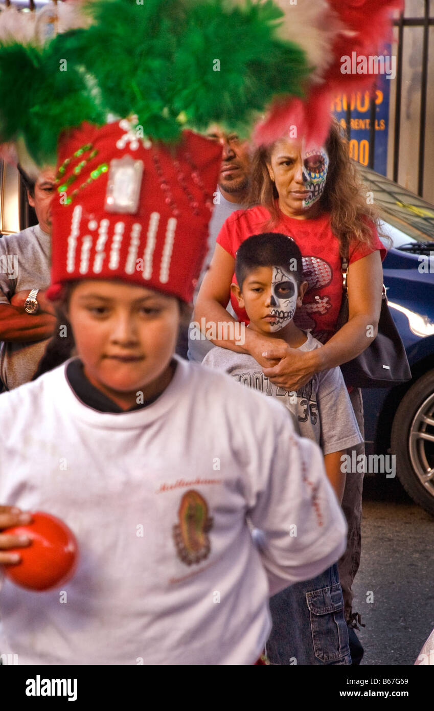 Hispanic mother and son in deaths-head makeup  to celebrate the Day of the Dead in Los Angeles, CA, USA Stock Photo