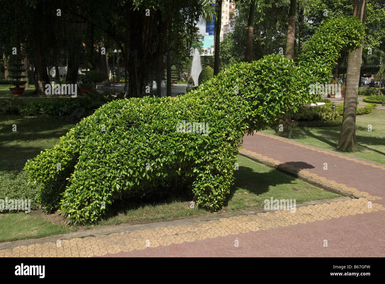 Elephant shaped park topiary Stock Photo
