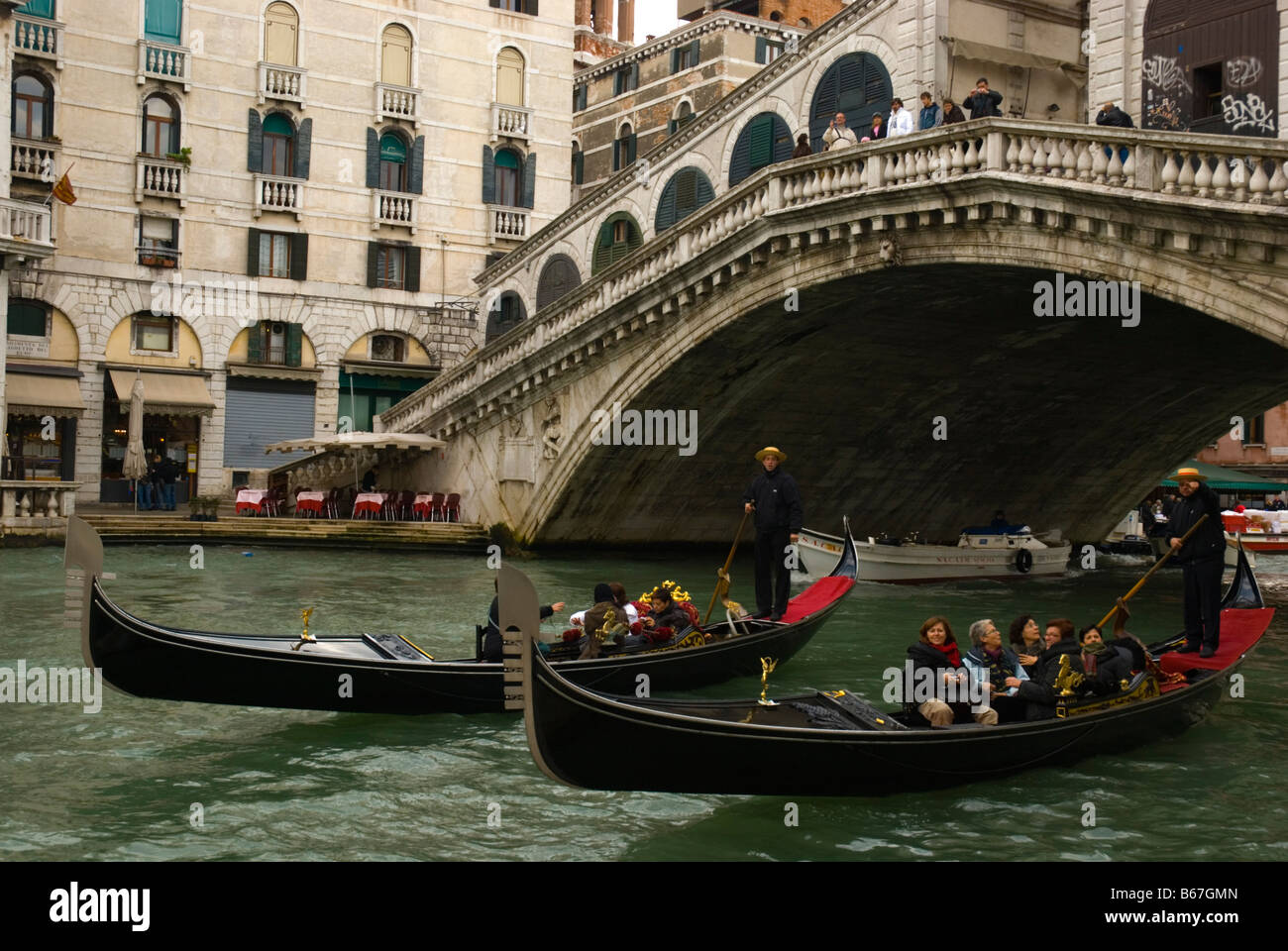 Two gondolas under Rialto bridge in Venice Italy Europe Stock Photo