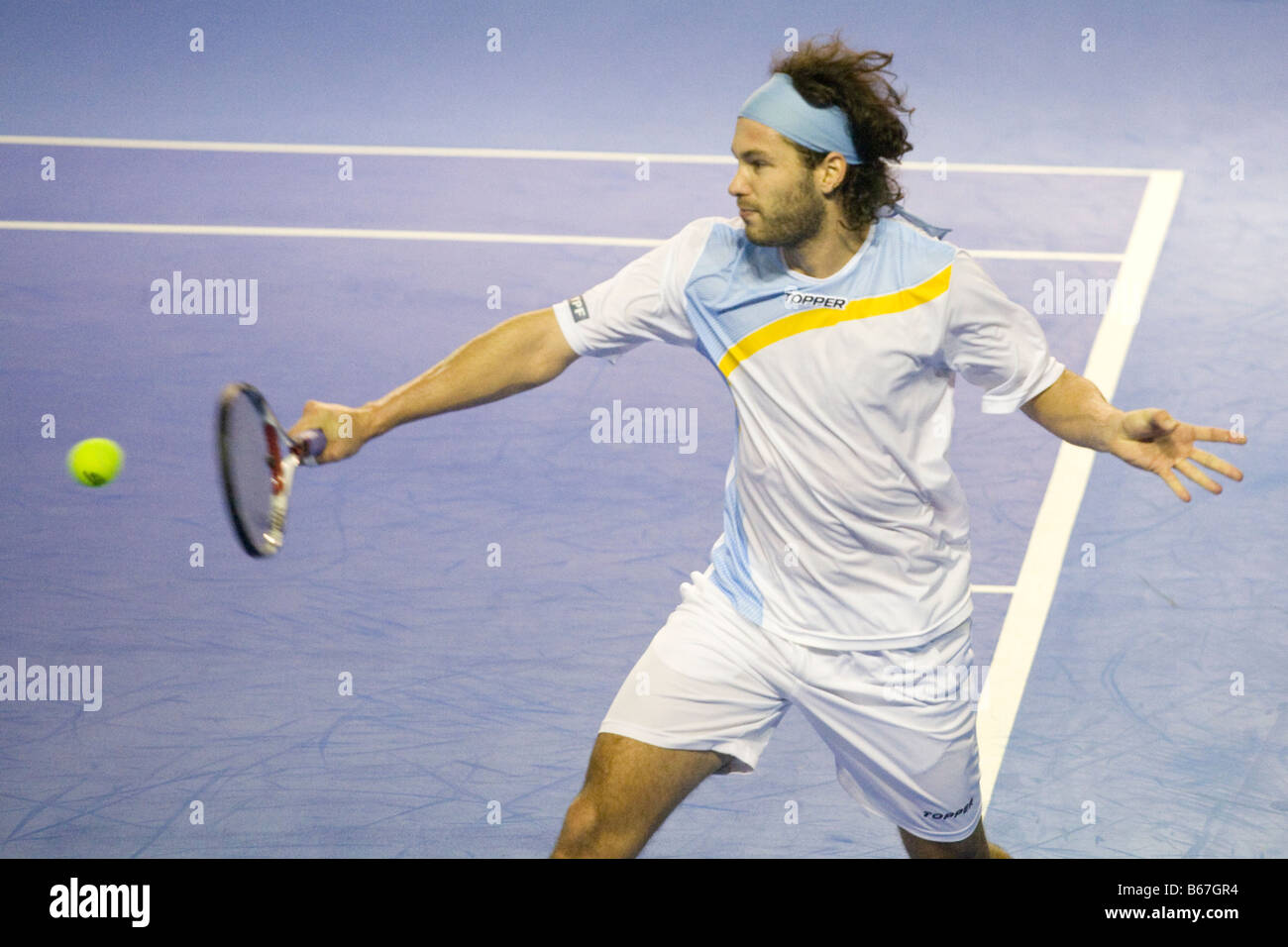 Argentinian tennis player Jose Acasusso hitting a backhand shot during the 2008 Davis Cup final against spanish Fernando Verdasc Stock Photo