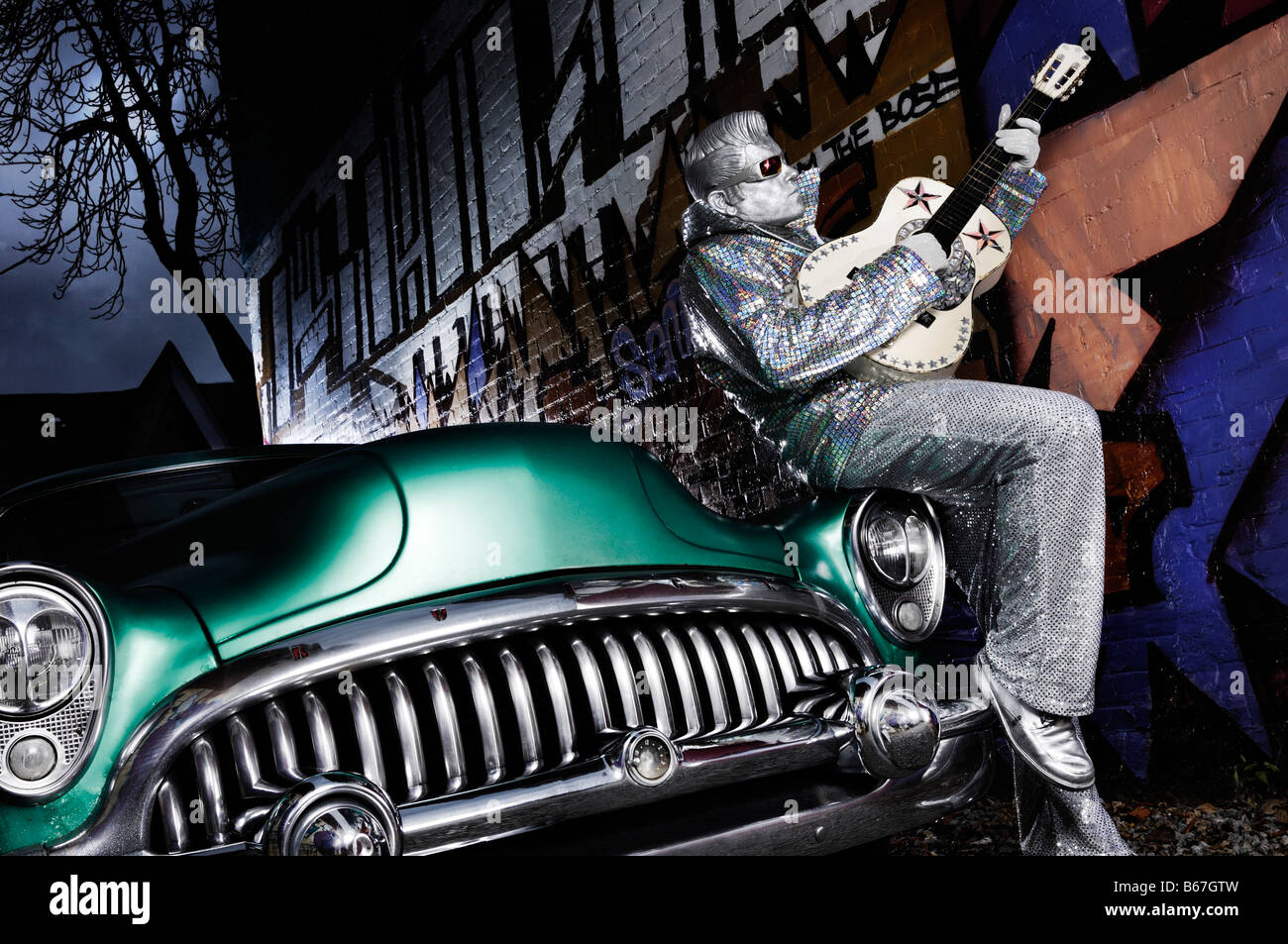 License available at MaximImages.com - Silver Elvis with a guitar Stock Photo