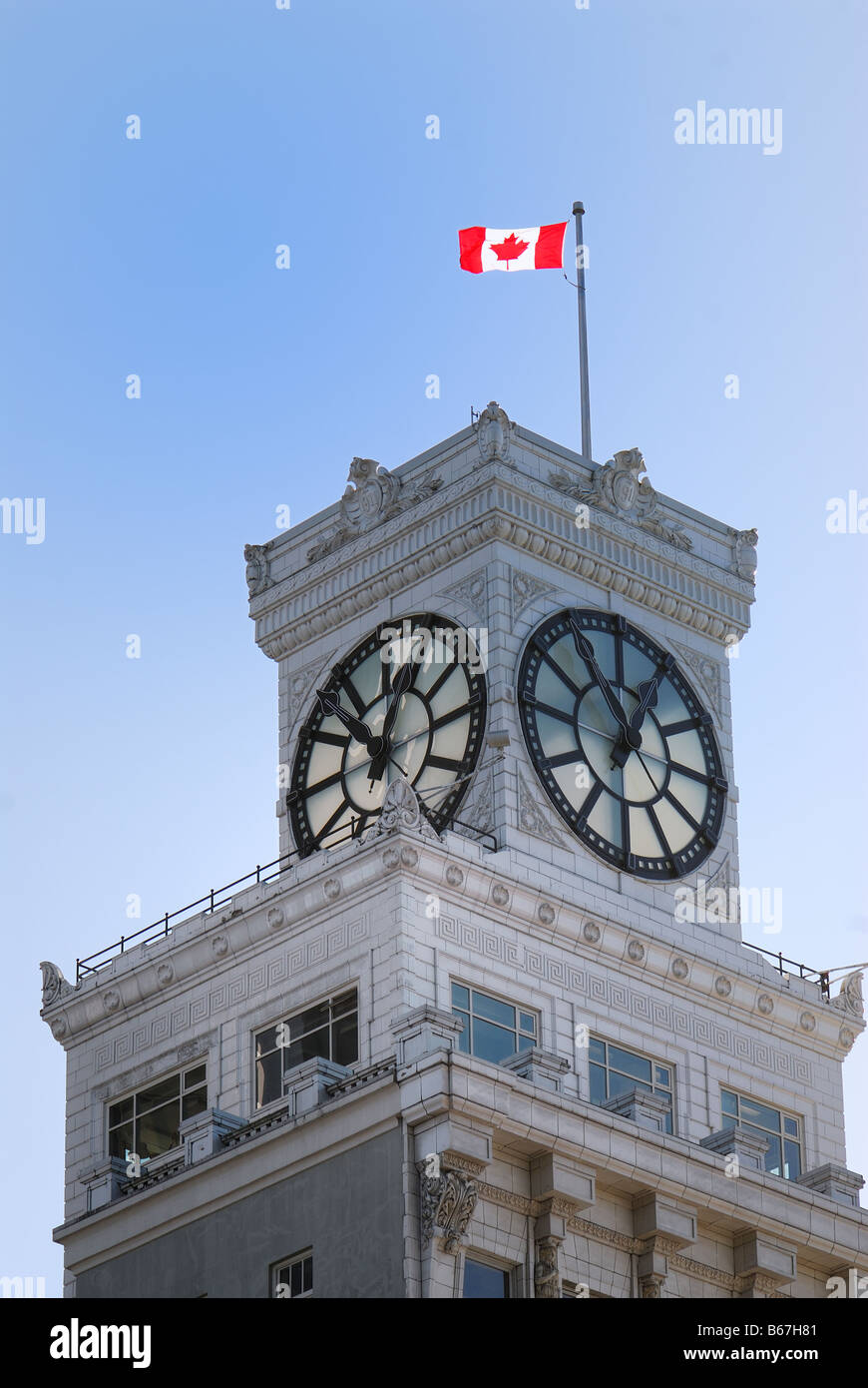 canadian flag on the Vancouver Block clock Tower in Vancouver downtown