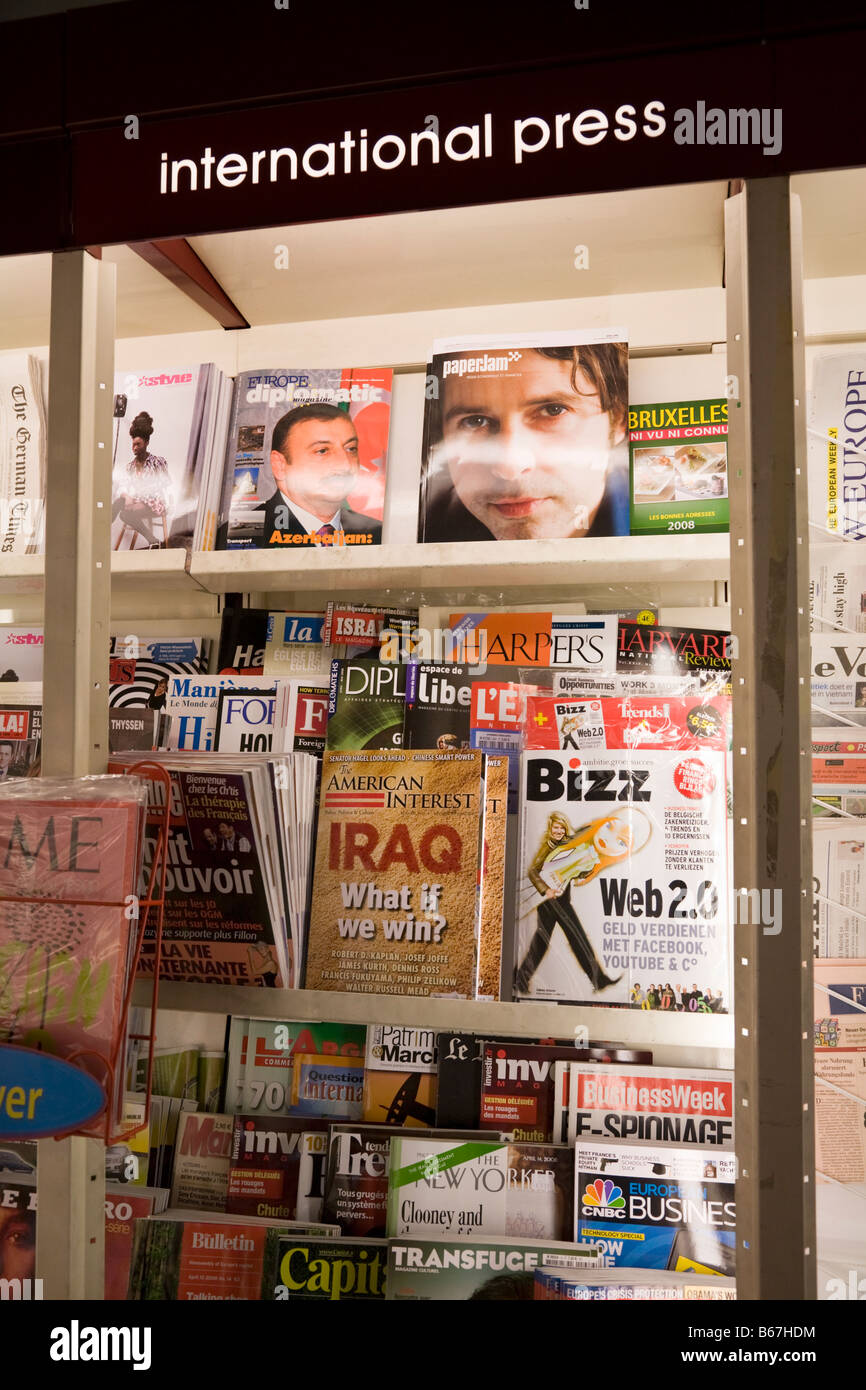 Current affairs magazines for sale at the Relay 'duty free' style shop in the Eurostar lounge of Brussels Midi station, Belgium. Stock Photo