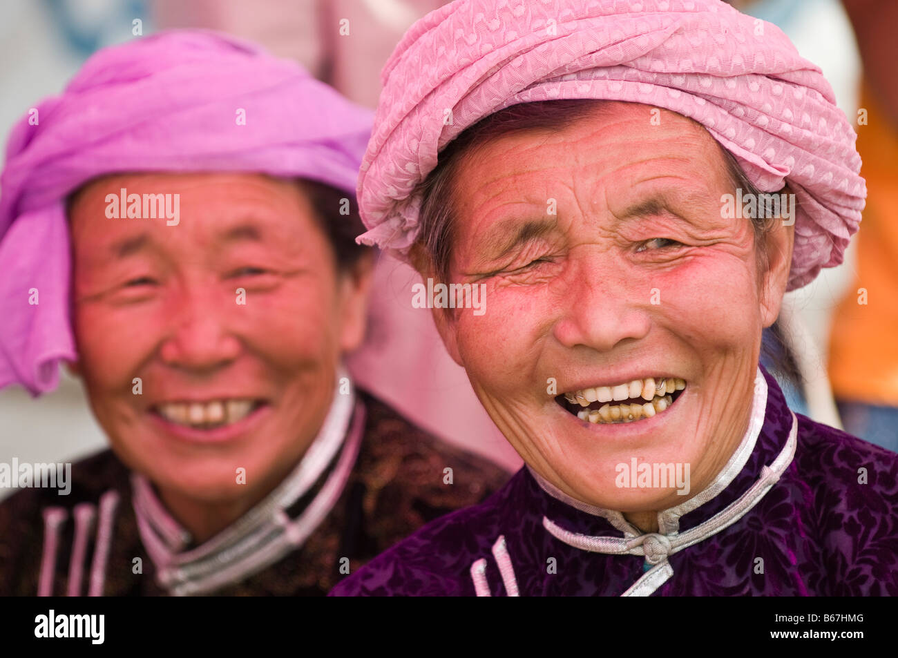 Traditionally dressed ethnic Mongolians attends summertime Naadam Festival Xiwuzhumuqinqi Inner Mongolia China Stock Photo