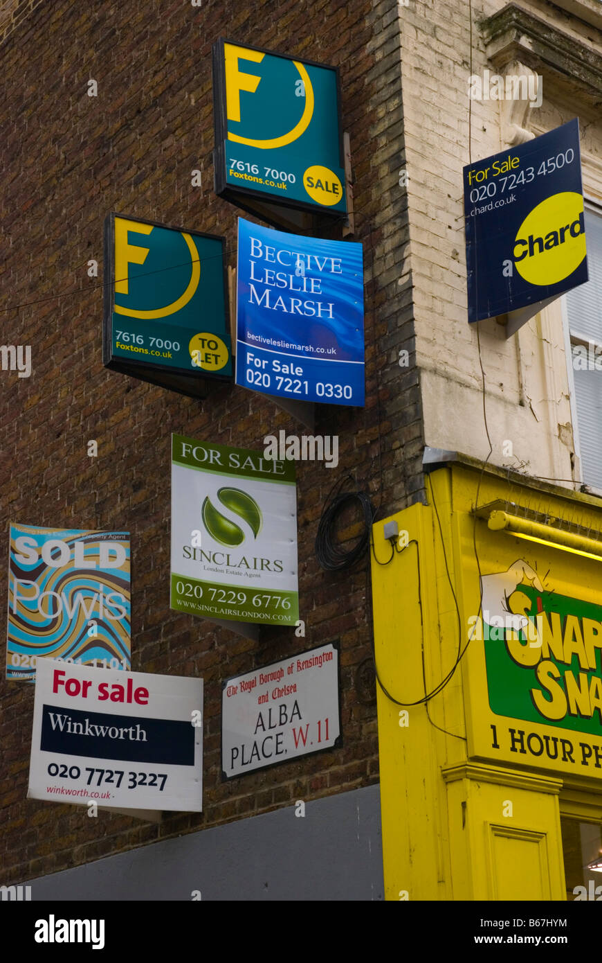 For sales sings for property at the corner of Portobello Road and Alba place in West London England UK Stock Photo