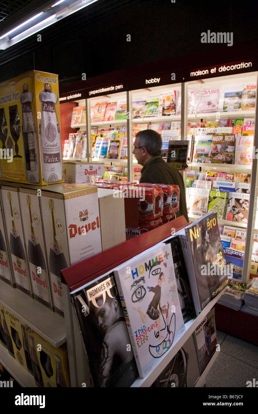 Eurostar train passengers inside the 'Relay' duty free style shop in