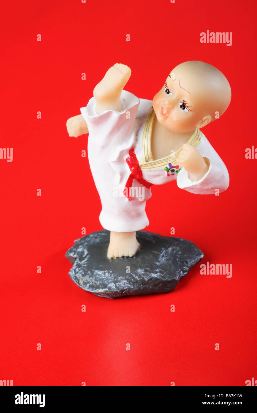 Close-up of a figurine kicking Stock Photo