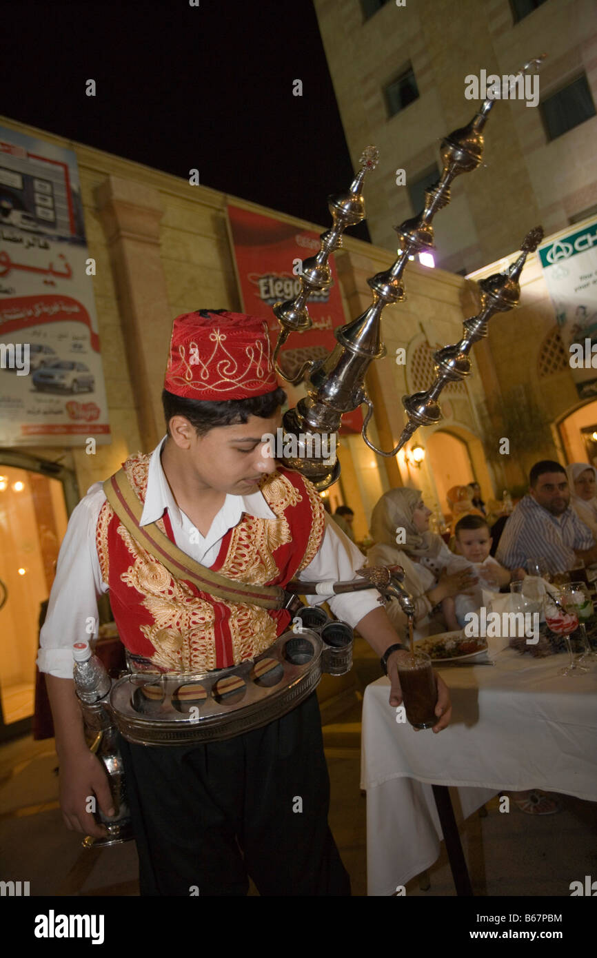 Man pouring Arabian Coffee during Ramadan Iftar Buffet at Sheraton Aleppo Hotel, Aleppo, Syria, Asia Stock Photo