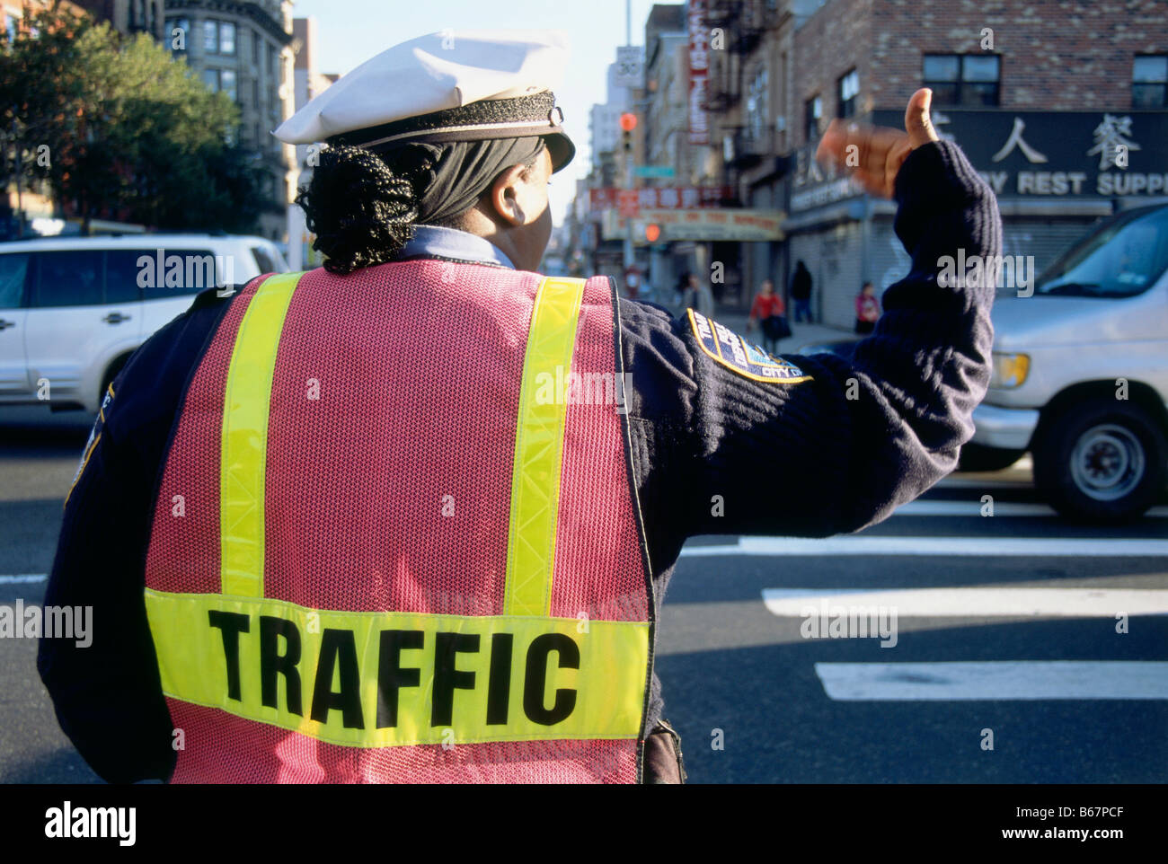 Police officer controlled the traffic, Chinatown, New York, USA, America Stock Photo