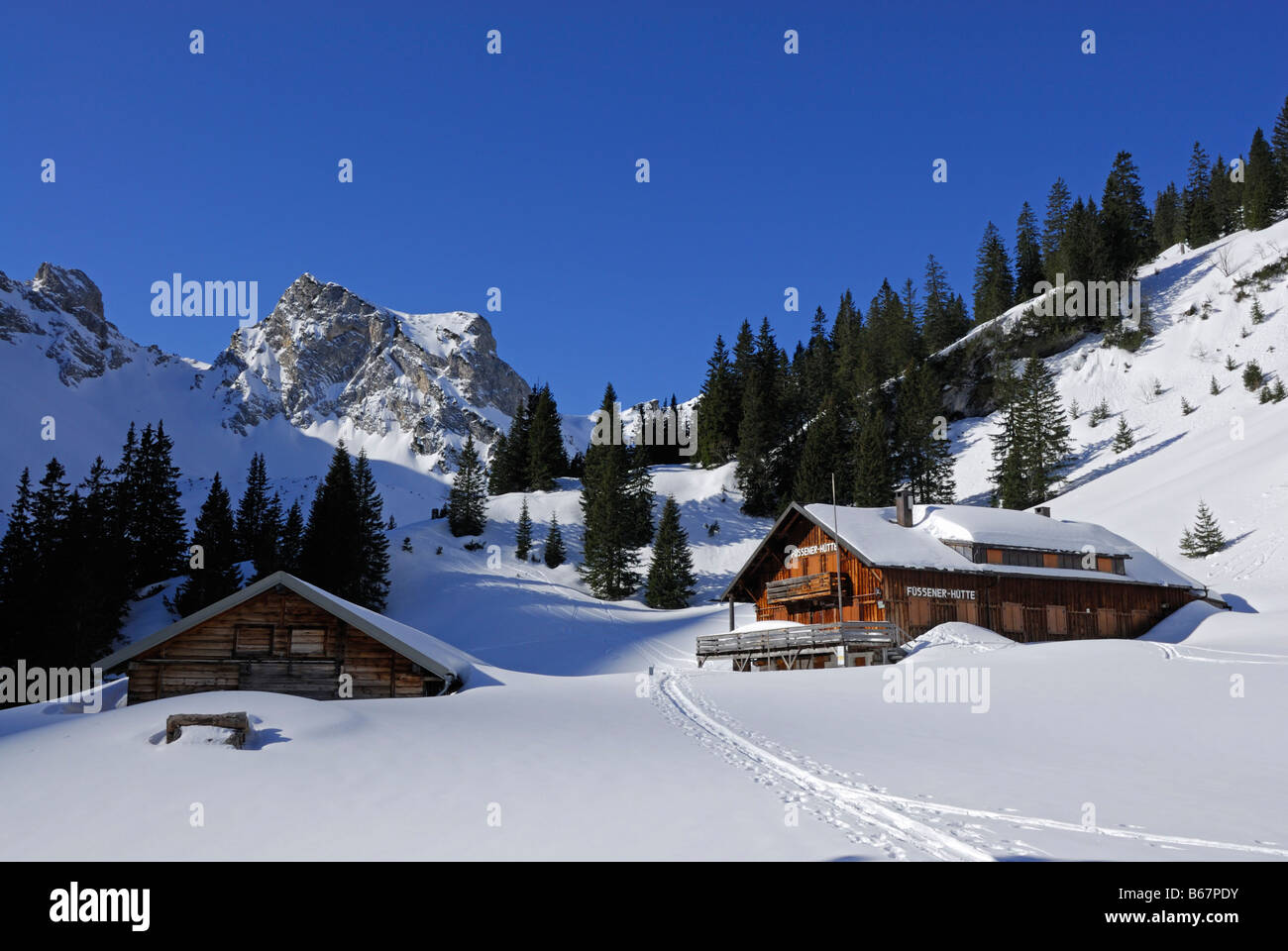 deeply snow-covered hut Fuessener Huette, Tannheim range, Allgaeu range, Allgaeu, Tyrol, Austria Stock Photo