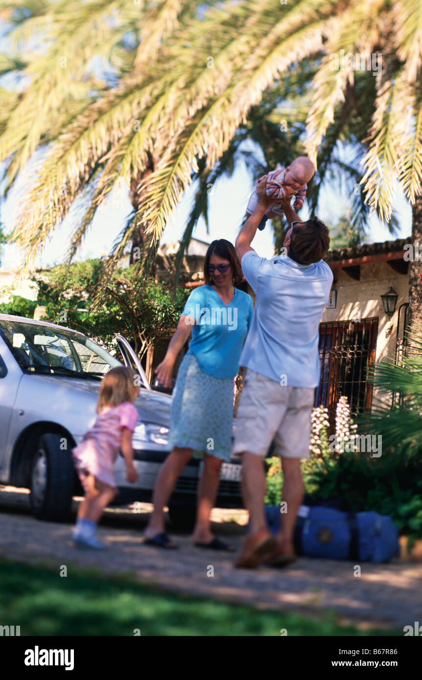 Family travelling, on holiday, car in the background, Holiday Appartment, Finca, Mallorca, Balearic Islands, Spain Stock Photo