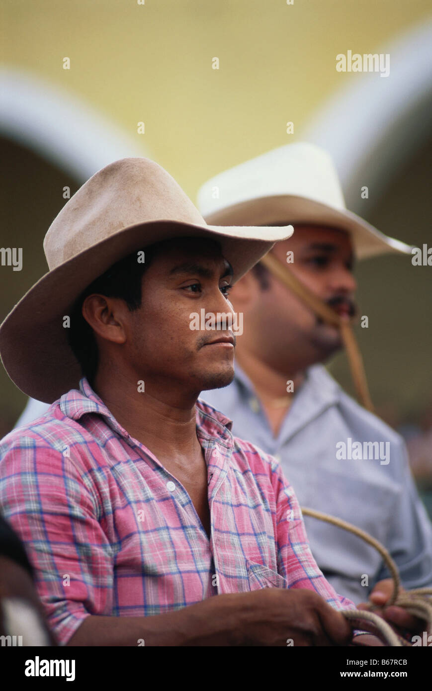 Two men helping out a the Corrida, Village Festival, Hunucma, Yucatan, Mexico Stock Photo