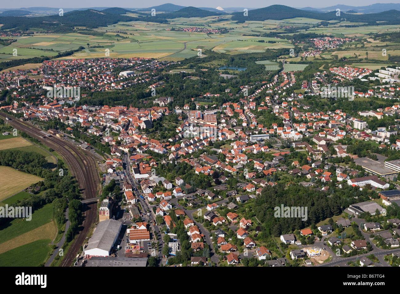 Aerial Photo of Huenfeld and Hessisches Kegelspiel Mountains, Huenfeld, Rhoen, Hesse, Germany Stock Photo