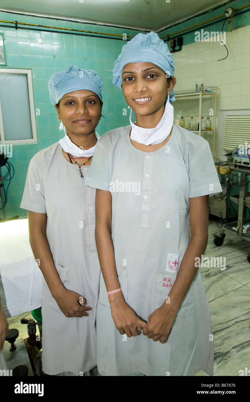 Theatre nurses in an operating theatre of the New Civil Hospital, Surat. Gujarat. (44) Stock Photo