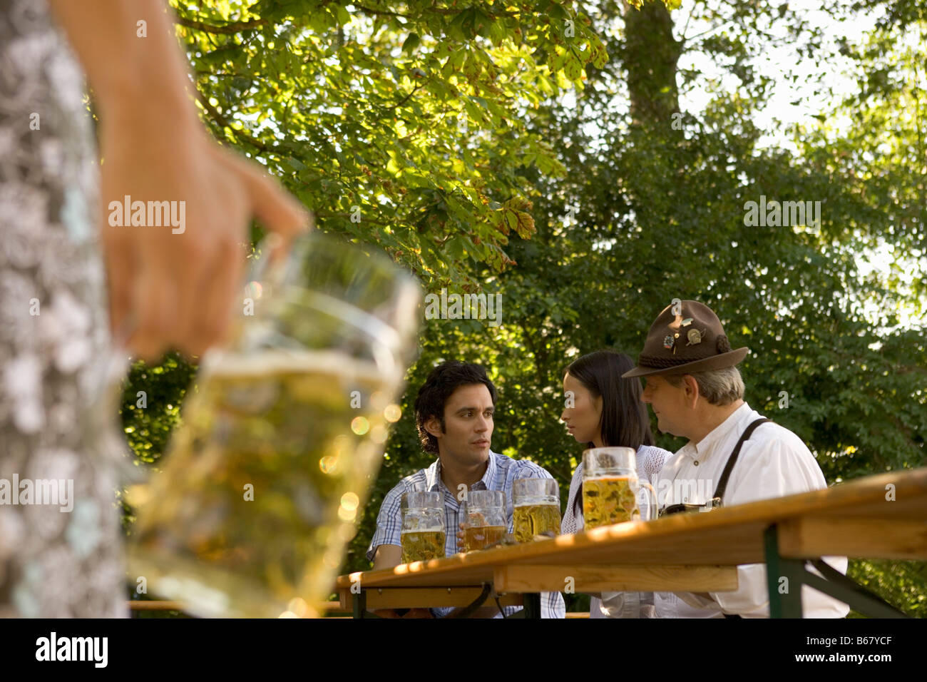 Friends in beergarden, Bavaria, Germany Stock Photo