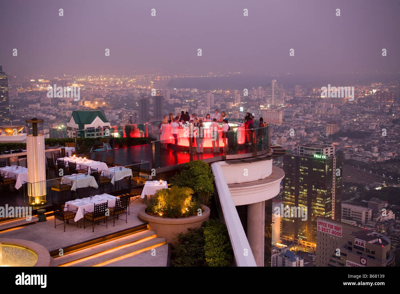 View over open air-bar Sirocco Sky Bar and Bangkok in the evening, State Tower, The Dome, Bangkok, Thailand Stock Photo