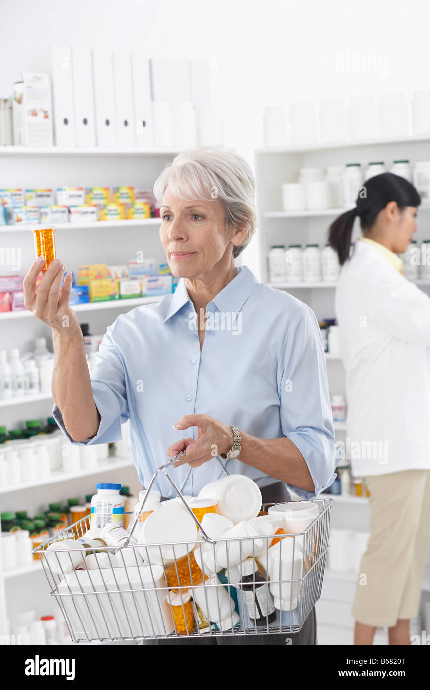 Old woman shopping in pharmacy hires stock photography and images Alamy