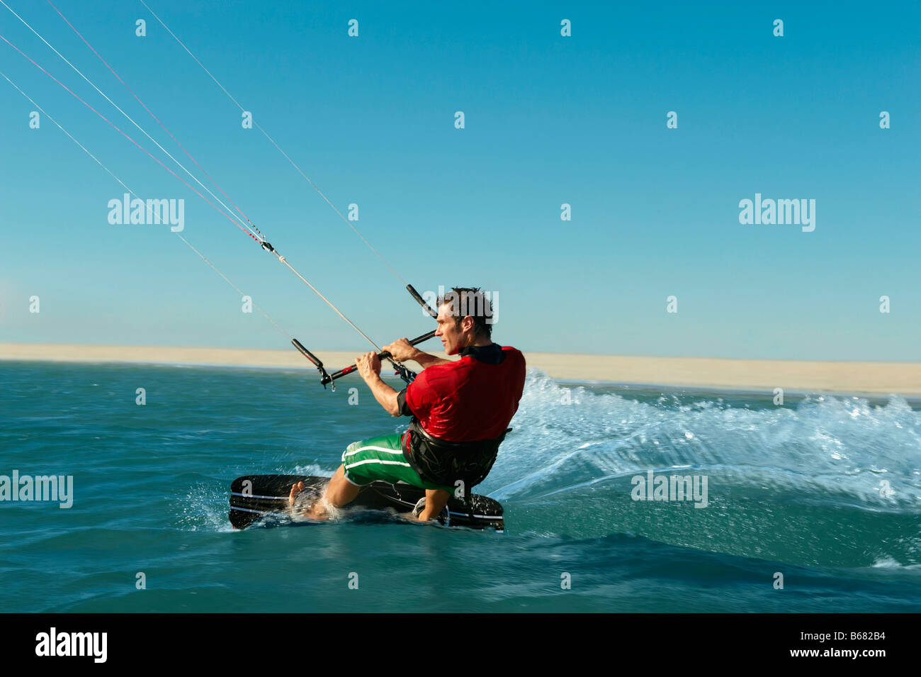 Man kitesurfing near beach Stock Photo Alamy