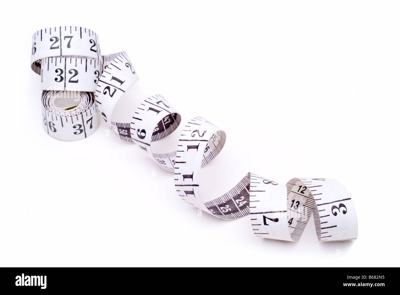Isolated white tape measure on white background Stock Photo - Alamy