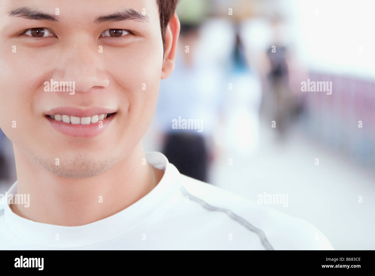 Portrait of a young man smiling Stock Photo - Alamy