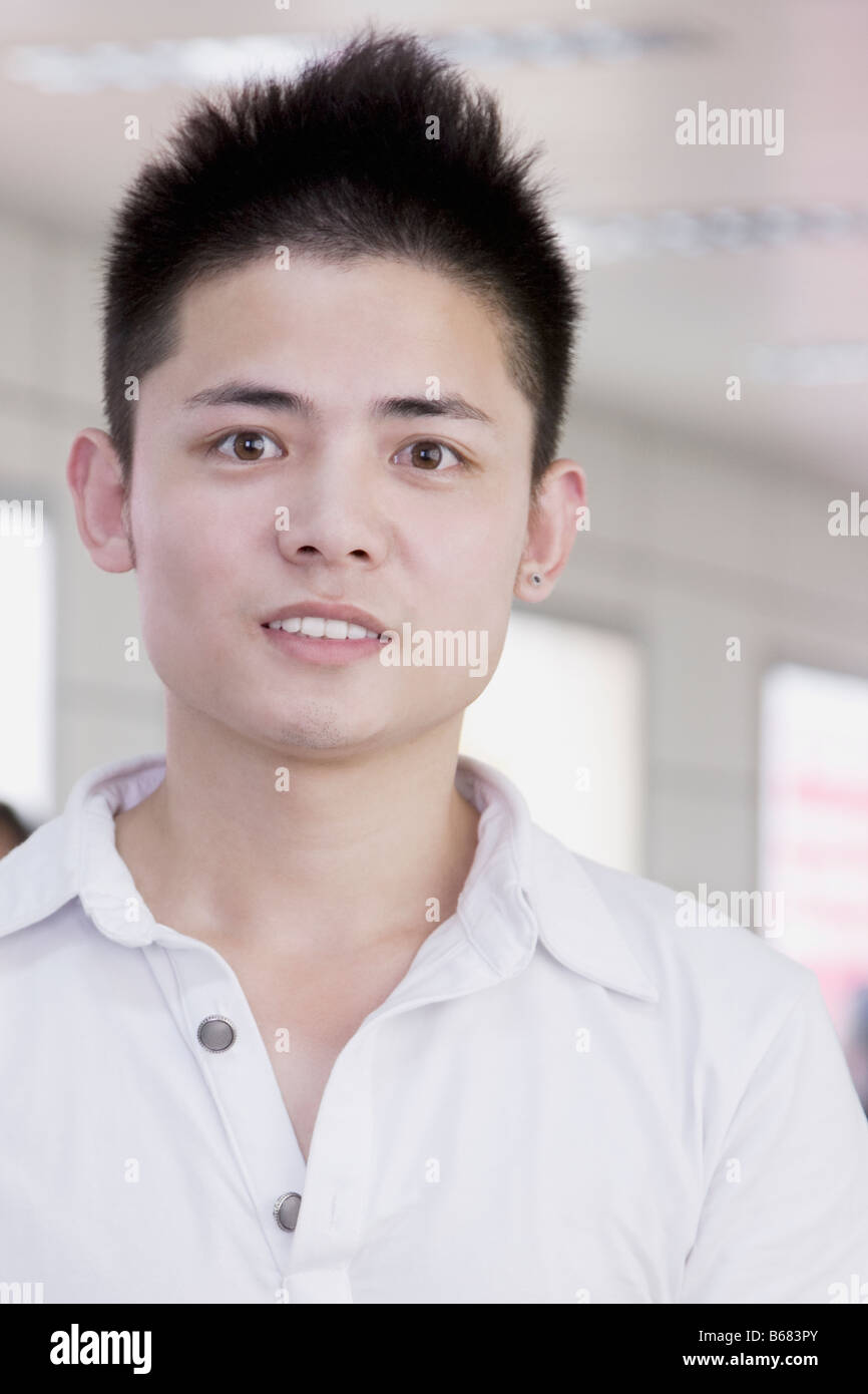 Portrait of a young man smiling Stock Photo - Alamy