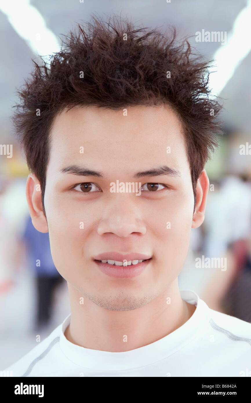 Portrait of a young man smiling Stock Photo - Alamy