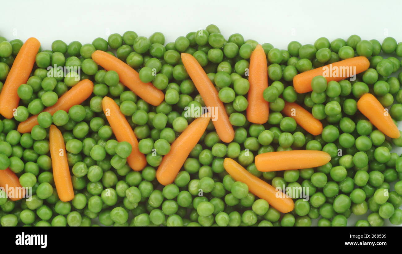 Closeup View of Green Peas and Baby Carrots Stock Photo Alamy
