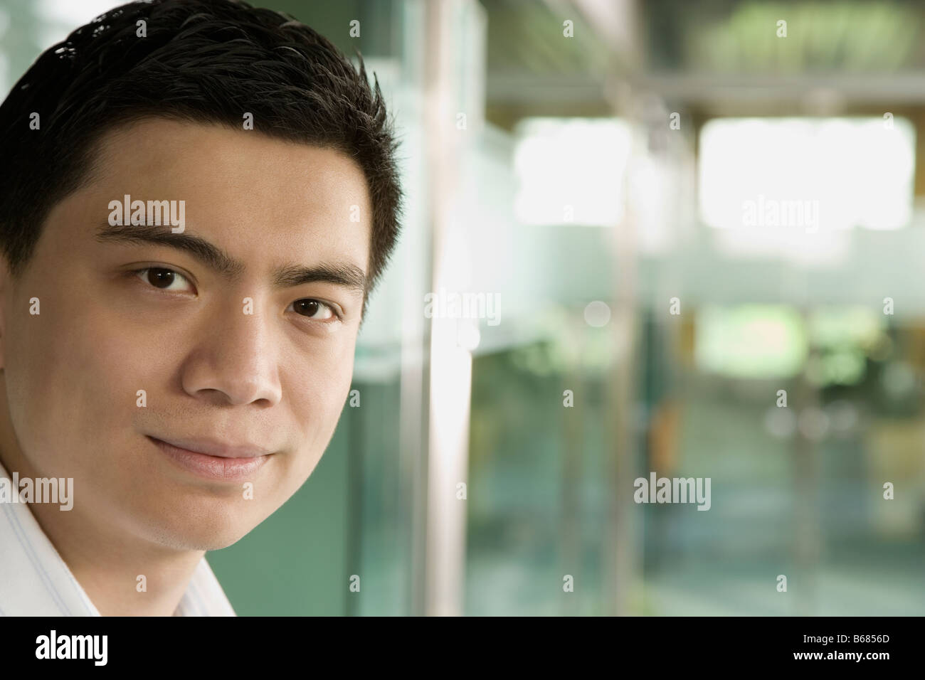 Portrait of a young man smiling Stock Photo - Alamy