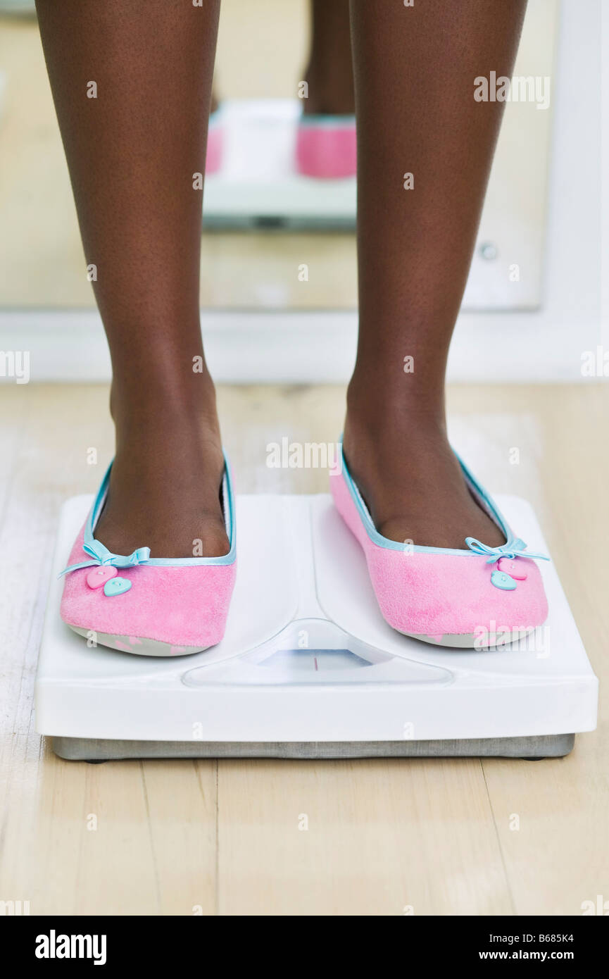 Woman's Feet on Bathroom Scale Stock Photo Alamy