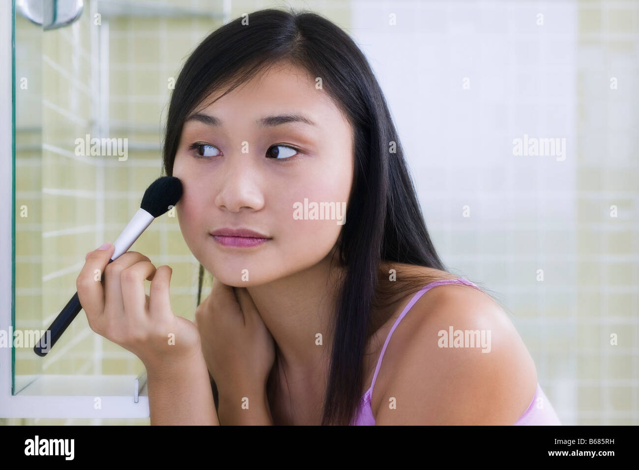 Woman Applying Make-up Stock Photo