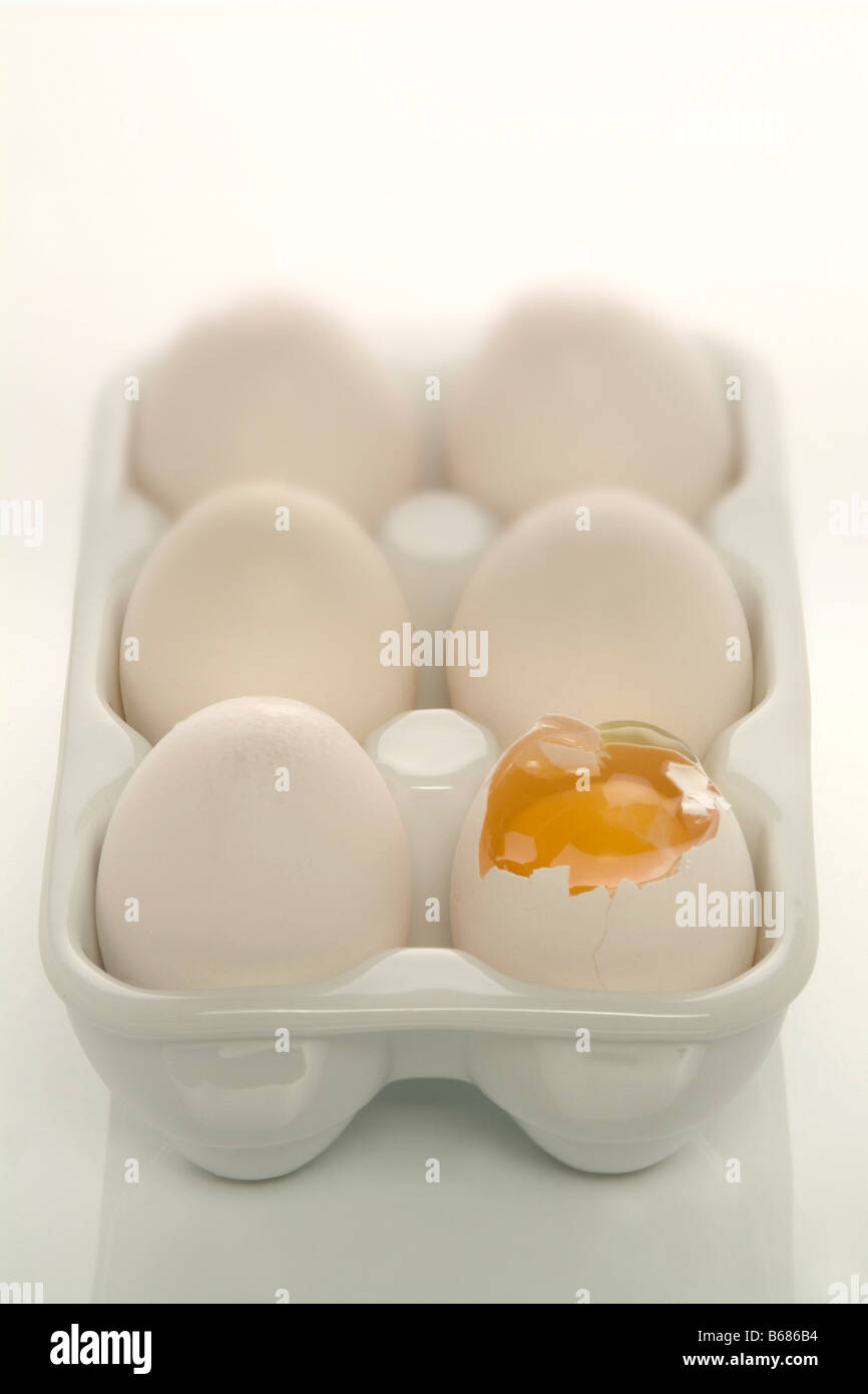 Broken Egg in Carton Stock Photo Alamy