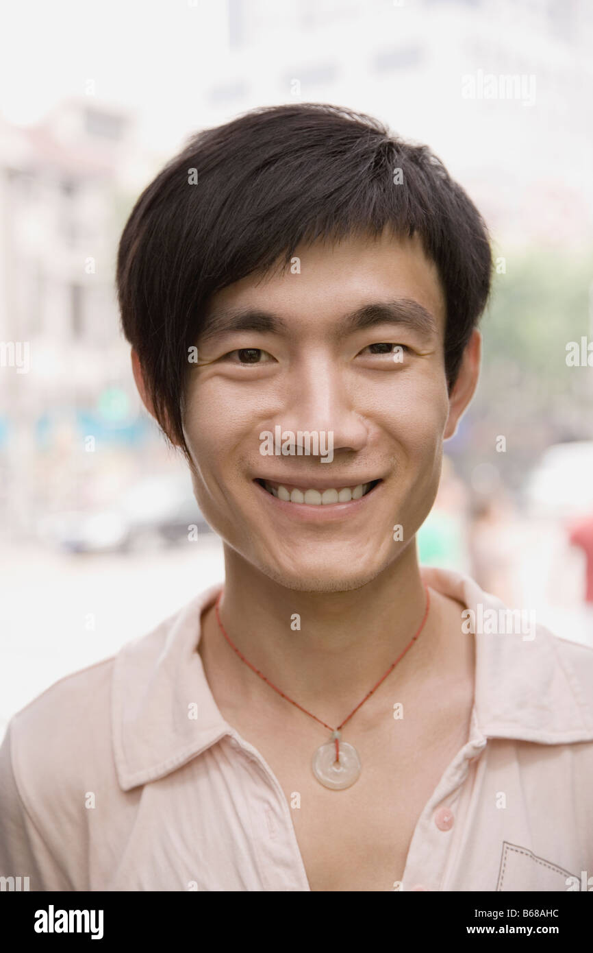 Portrait of a young man smiling Stock Photo - Alamy