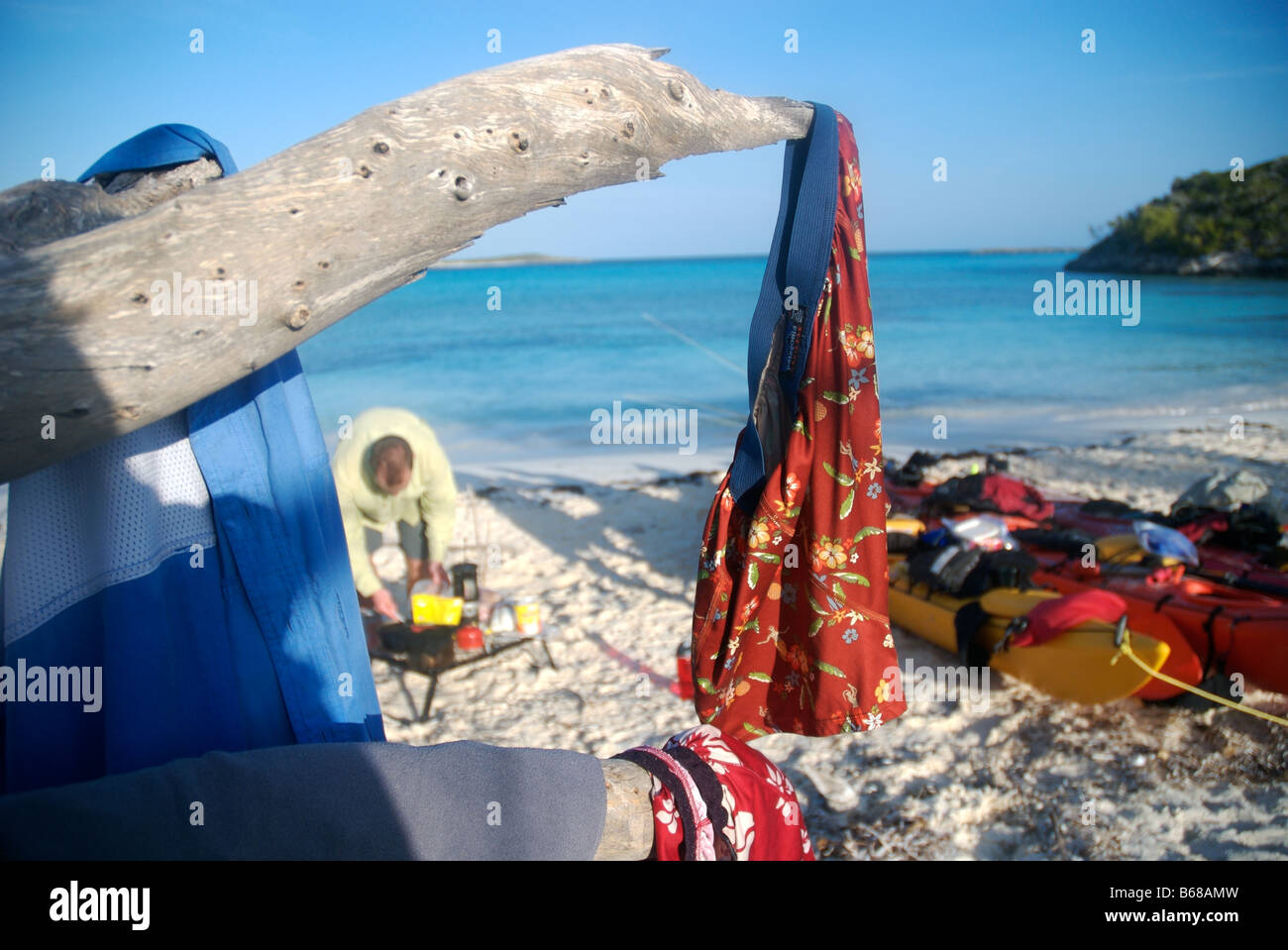 camping on a remote beach while sea kayaking the exuma islands, bahamas Stock Photo
