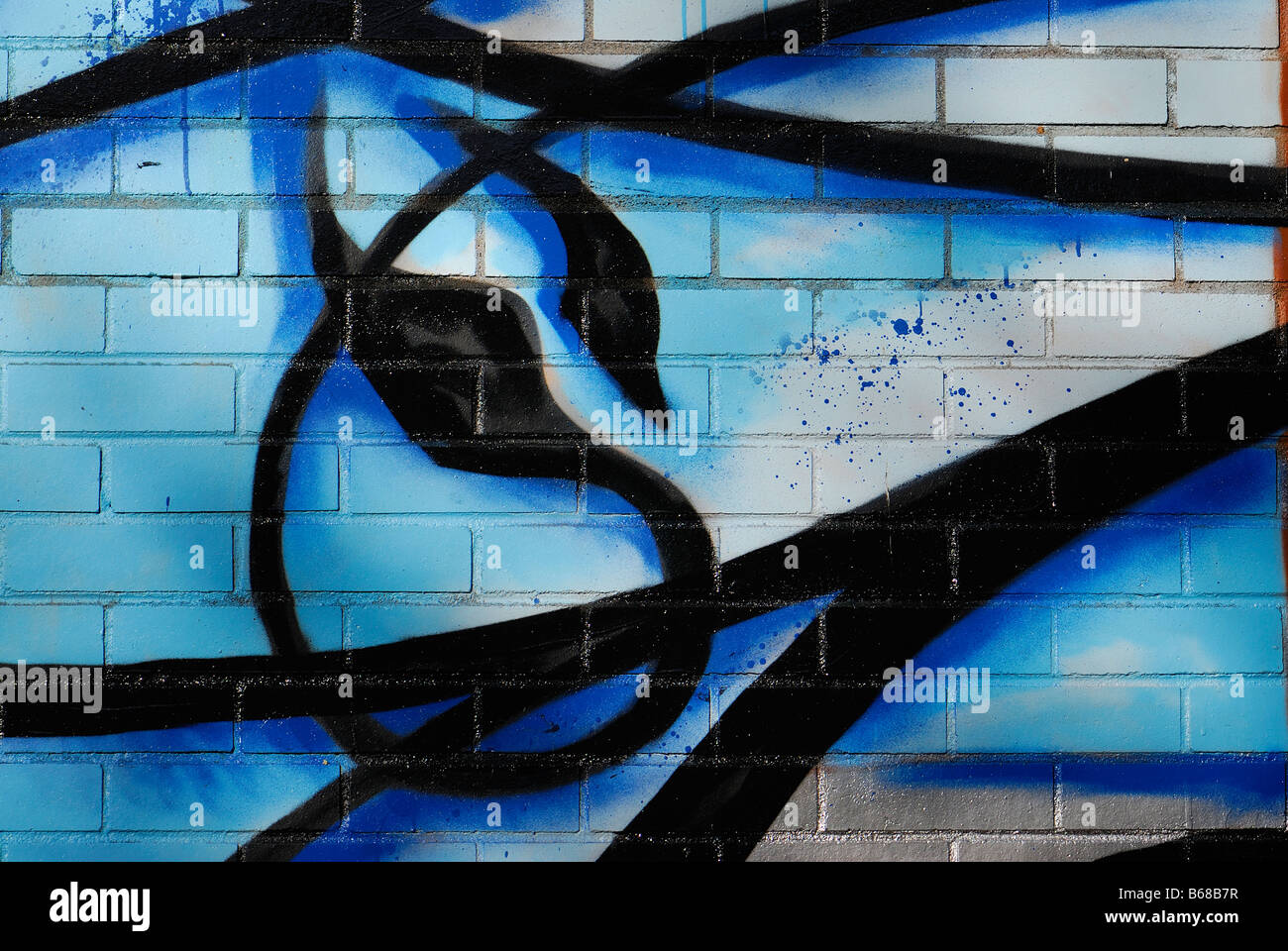 graffiti artist blue marine and black painting on a brick wall in west end vancouver city british columbia Stock Photo