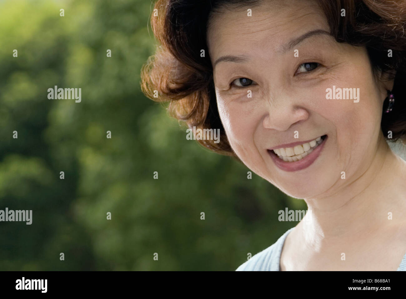 Portrait of a mature woman smiling Stock Photo - Alamy