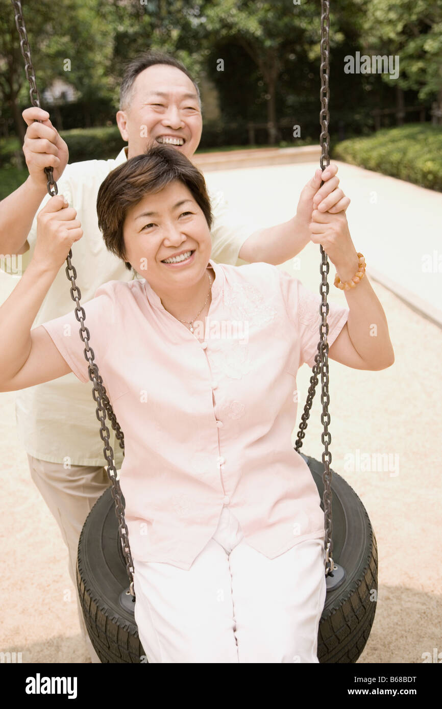 Older woman swinging hi-res stock photography and images - Alamy