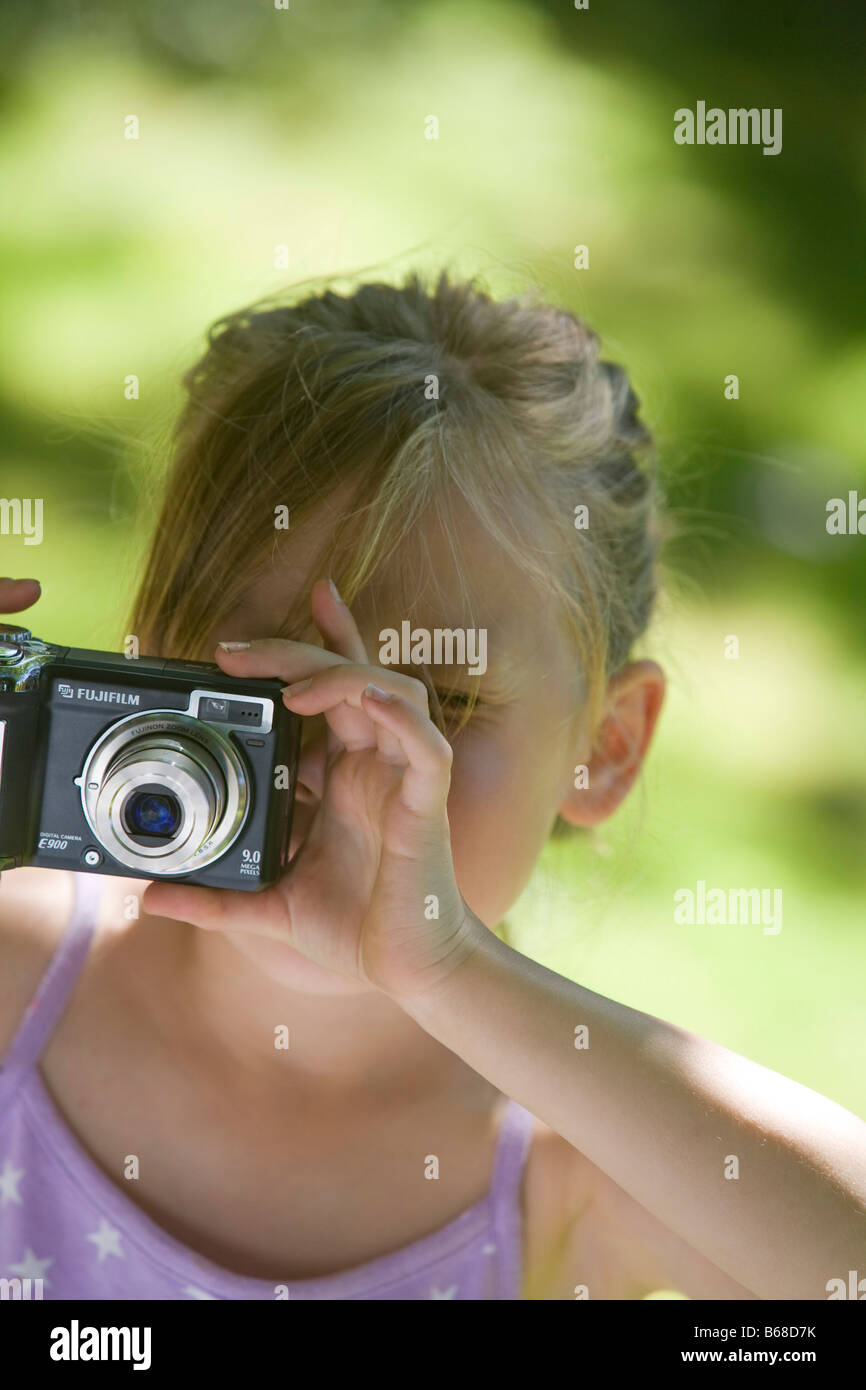 Young girl using digital camera Stock Photo - Alamy