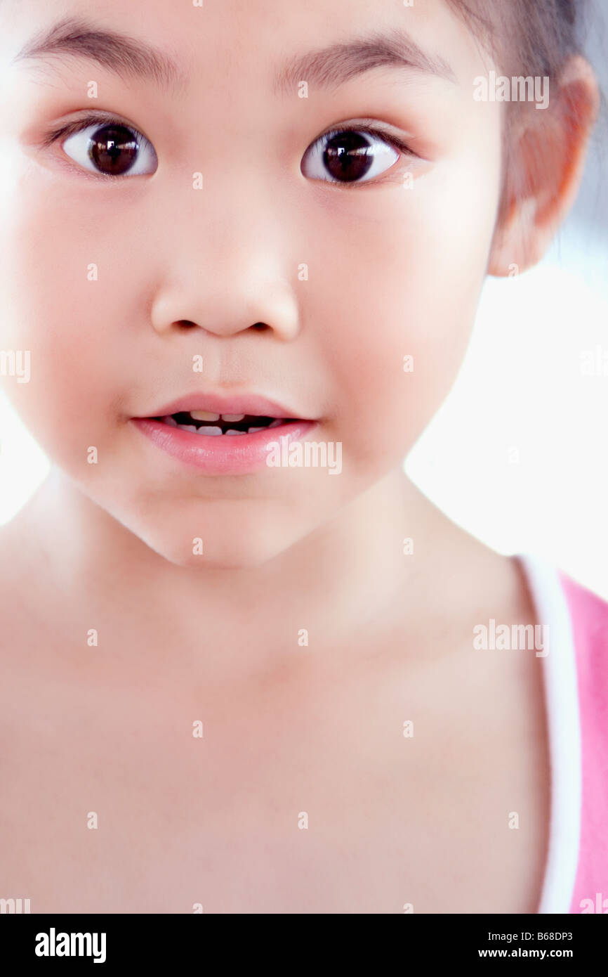 Portrait of a girl looking surprised Stock Photo - Alamy
