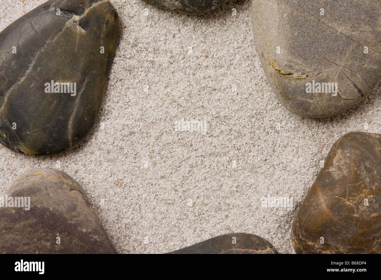 Pebbles in sand ring formation Stock Photo Alamy