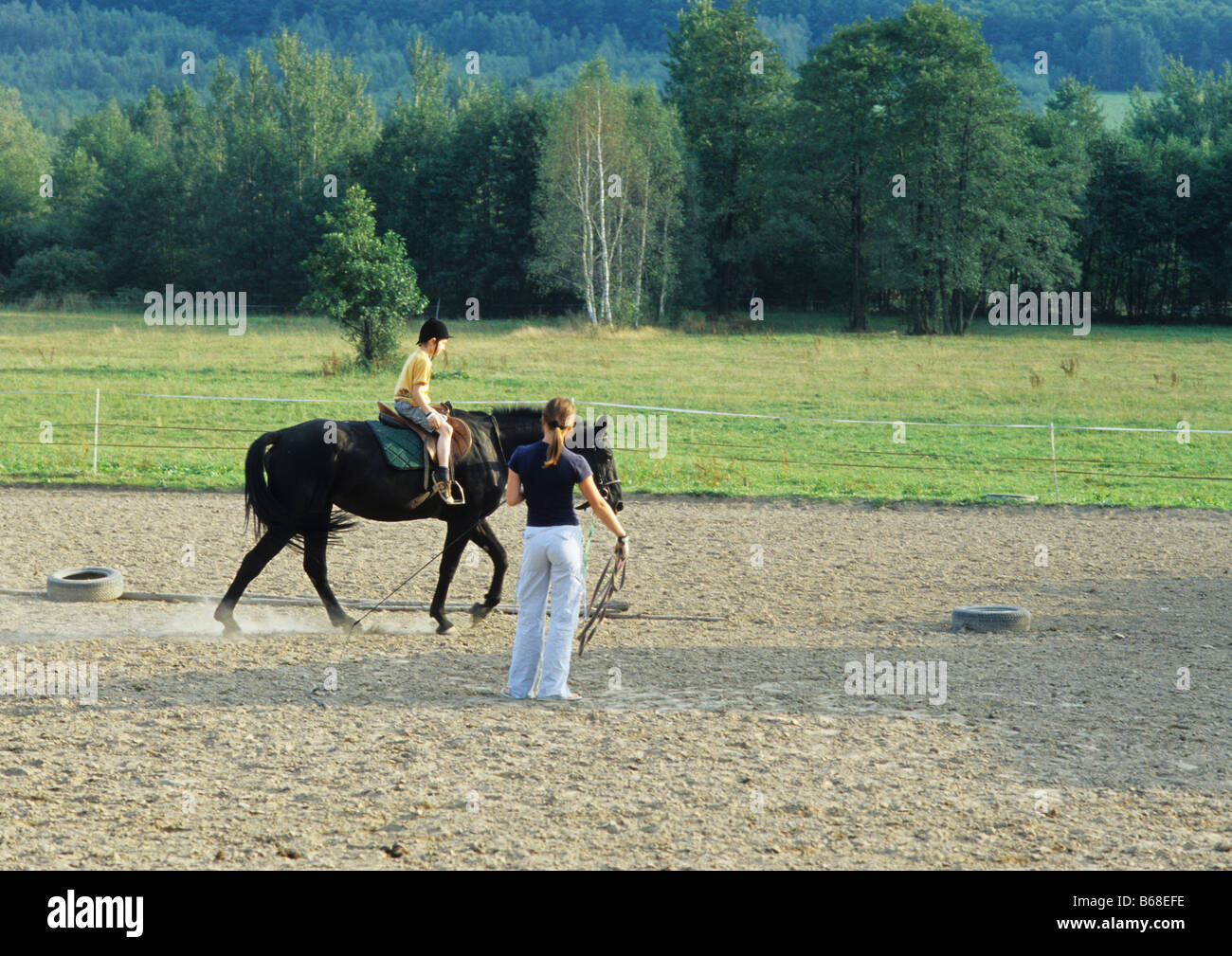 Poland Kapkazy village,  boy takes riding horse lesson Stock Photo