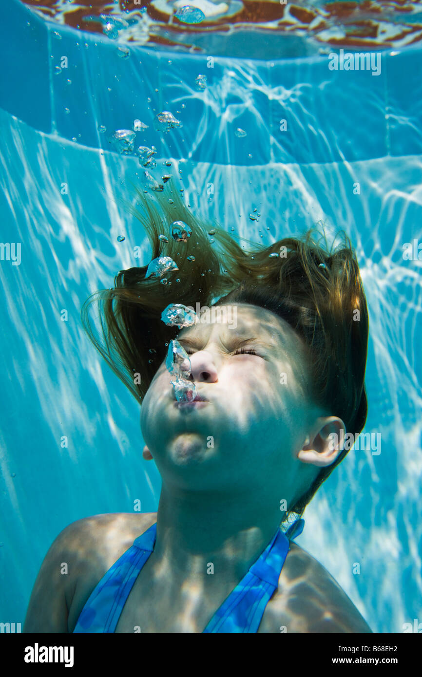 Girl (69) with eyes closed underwater Stock Photo Alamy