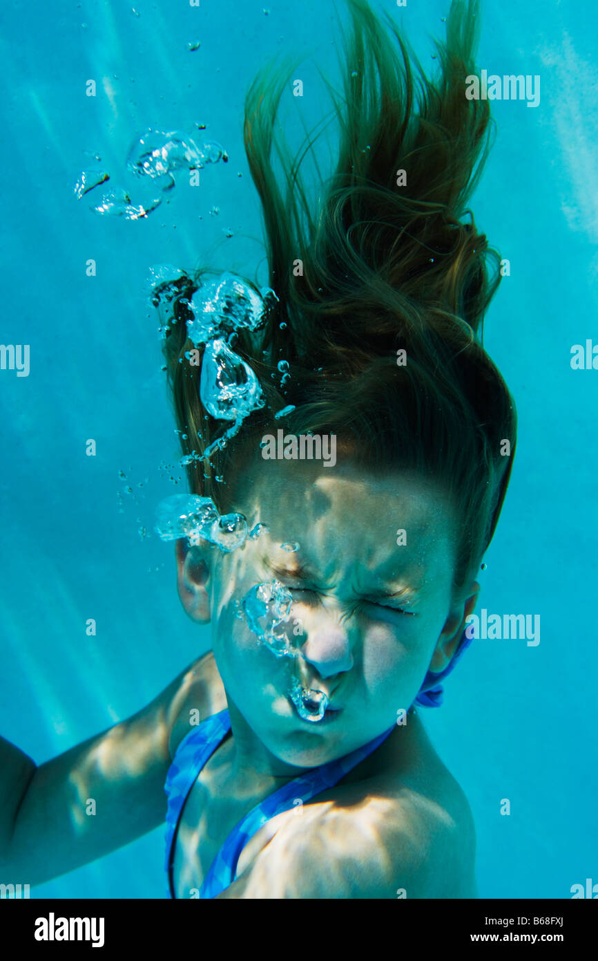 Girl (69) with eyes closed underwater Stock Photo Alamy