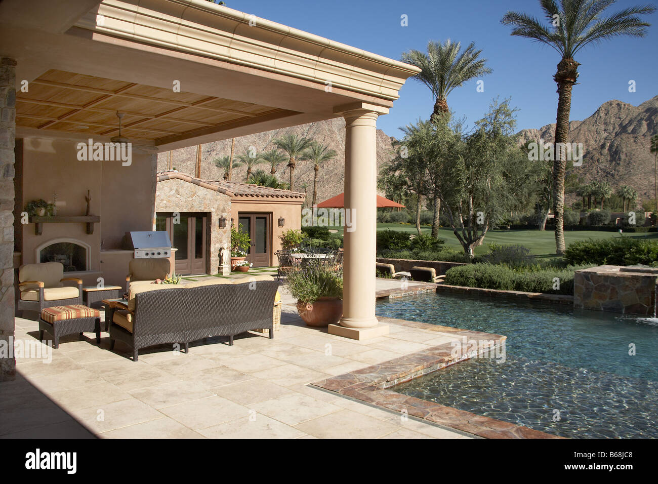 Outdoor living room with pool Stock Photo - Alamy