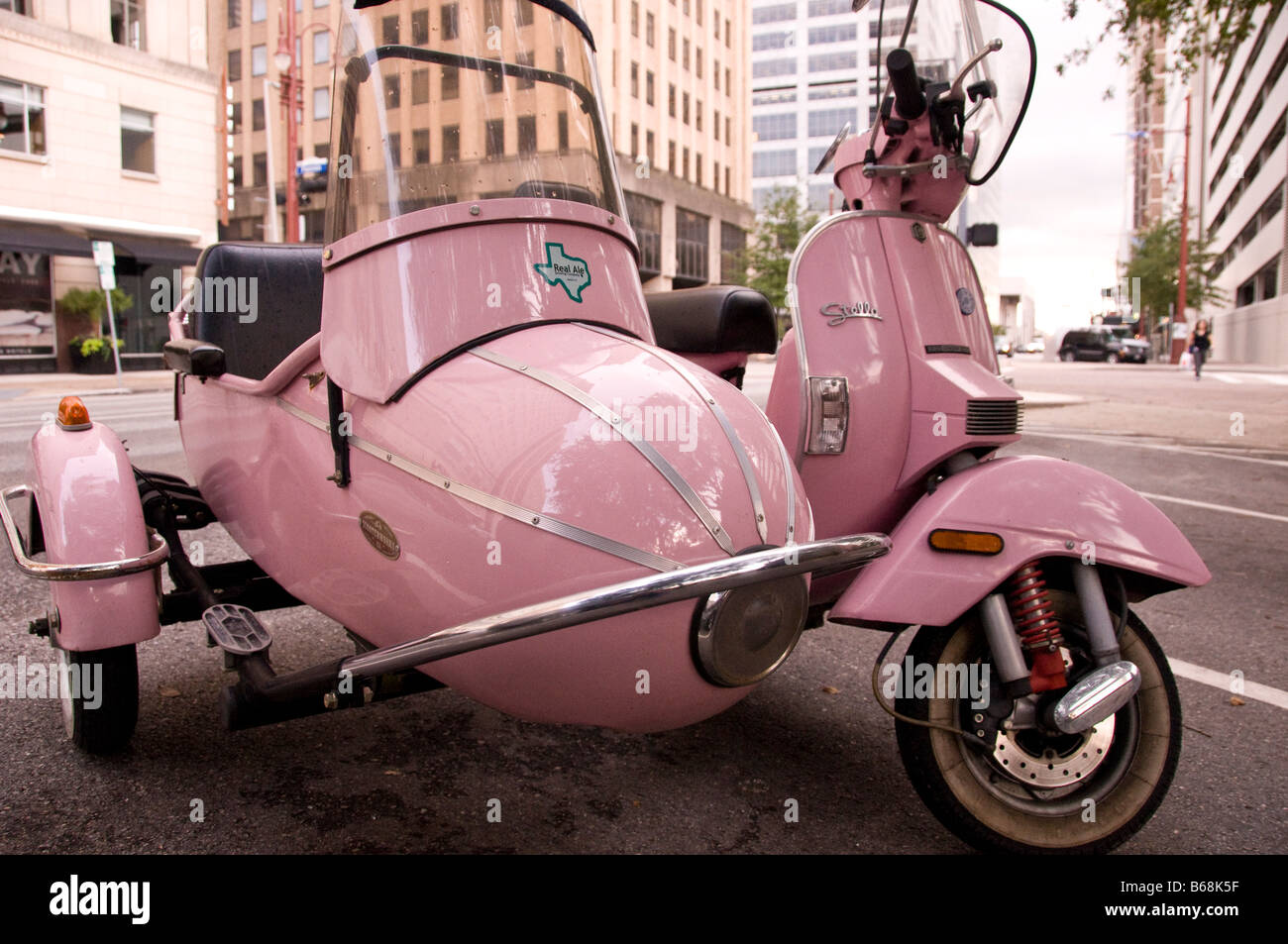 pink vespa with sidecar