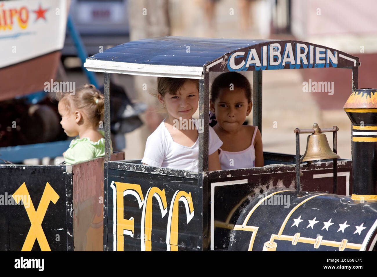 Cuban children play at the amusement park. Remedios, Cuba. Caribbean. Stock Photo