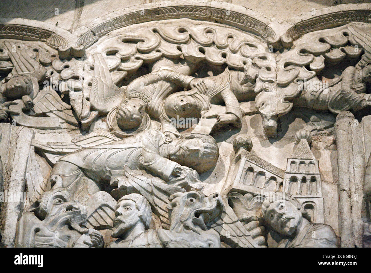 Medieval stone sculpture, bas relief on portal of the church of St. Marie (11201135), Souillac